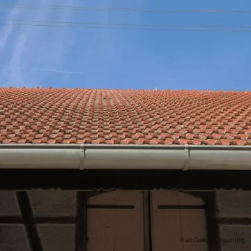 A photo of a roof with freshly cleaned gutters in Austin, TX, near Cedar Park. Our gutter cleaning service ensures your system is free of debris, allowing for smooth drainage and helping prevent water